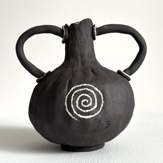 Miniature Dark Clay Vessel with Spiral Motif